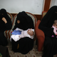 Uighur refugees wait during an interview with Reuters in Istanbul, Turkey.